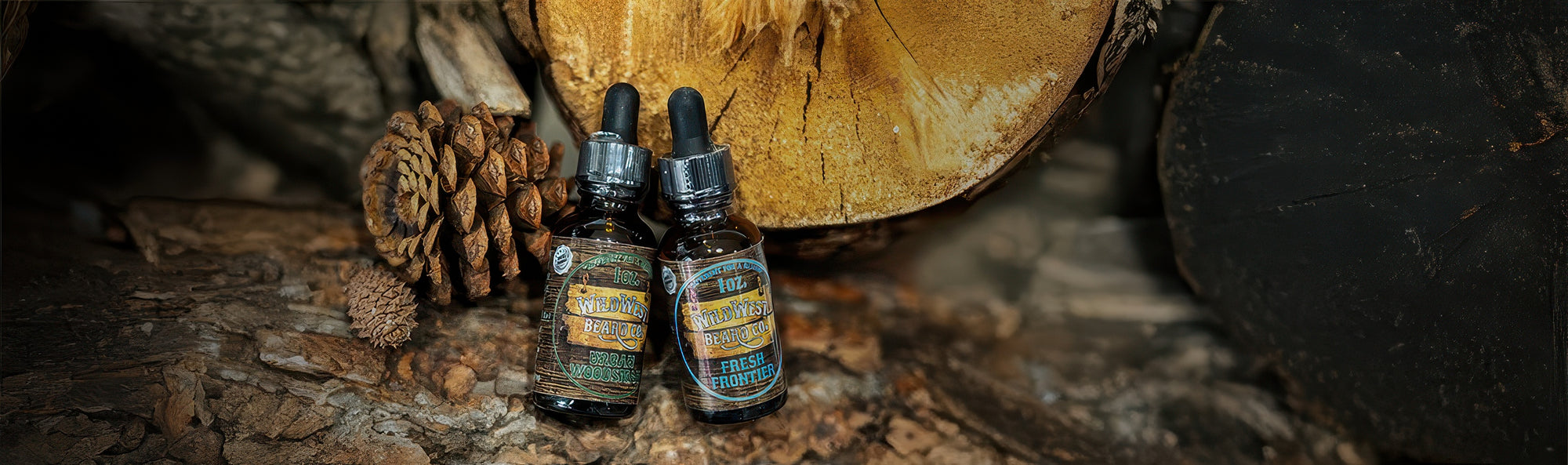 Two small bottles with droppers on a wooden surface