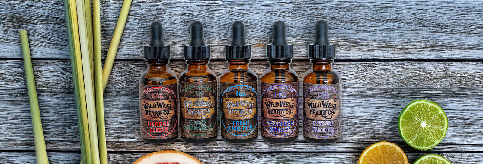 Row of Wild West Beard Oil bottles on a wooden surface with herbs and fruits.